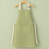 One green striped bib apron with beige straps and divided front pocket.