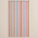 A vertical beaded curtain hanging from a metal rod, featuring multiple columns of translucent beads in red, pink, orange, yellow, green, and blue on a light beige background.