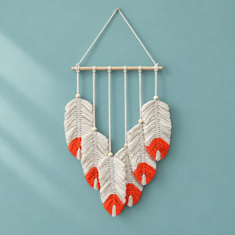Seven combed macrame feathers with coral red tips on a teal background