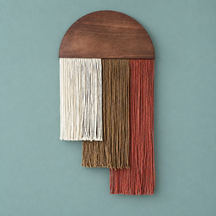Red option studio on pale teal, wood dome over three stepped fringe blocks