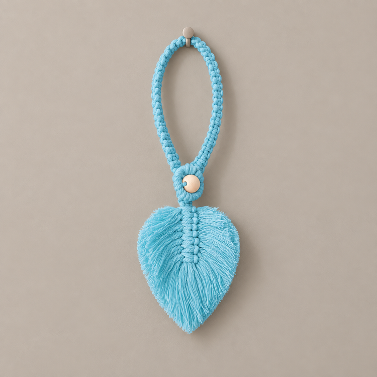 Sky blue studio on gray, macrame leaf holdbacks in 6 colors, twisted cord, combed flat at the leaf, round pale wooden bead