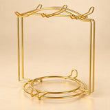 One empty gold smooth-wire cup-and-saucer rack.
