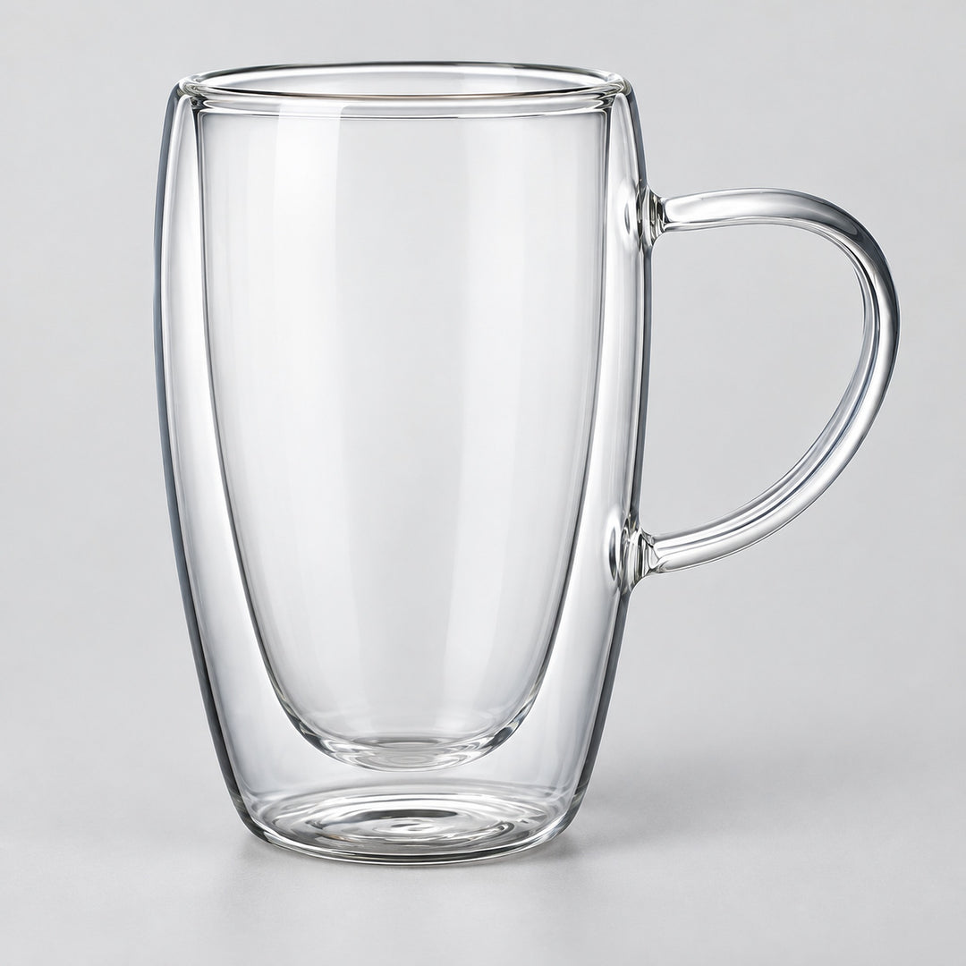 One empty tall 450 ml clear double-wall glass mug with handle.