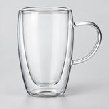 One empty tall 450 ml clear double-wall glass mug with handle.