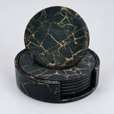 Six black and gold 10 cm artificial-leather coasters with matching holder.