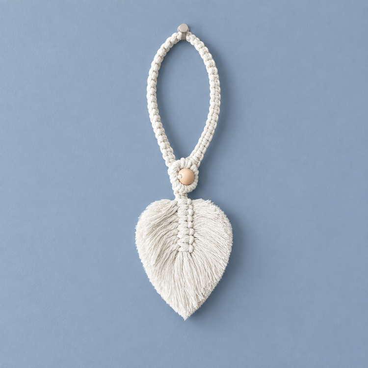 White studio on blue, macrame leaf holdbacks in 6 colors, twisted cord, combed flat at the leaf, round pale wooden bead