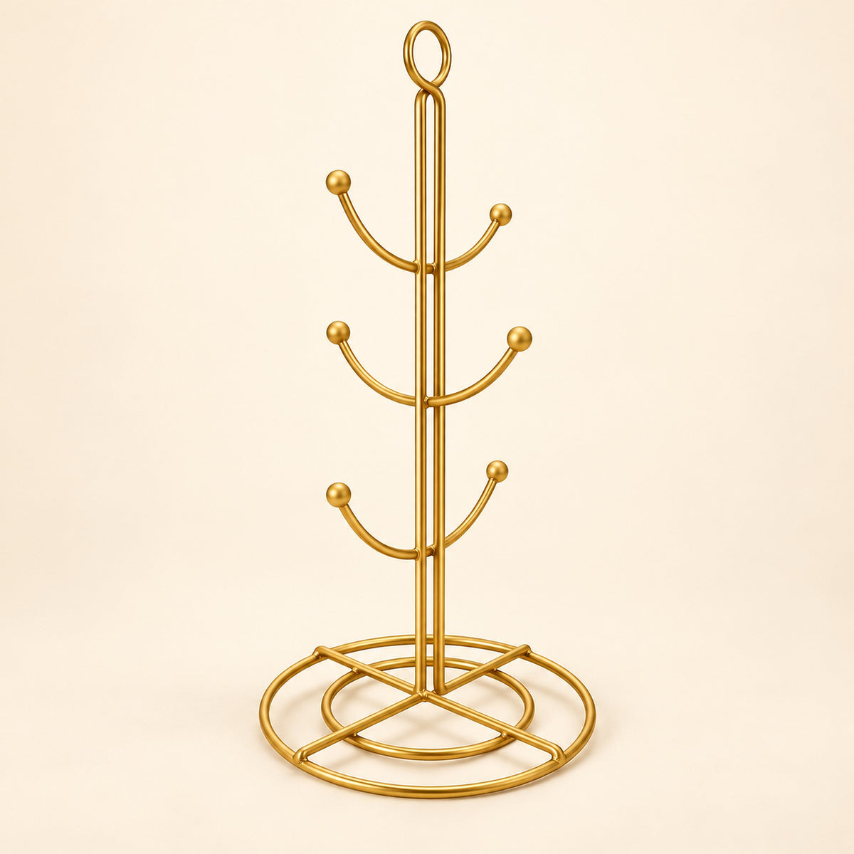 One empty gold six-hook mug tree with circular base.