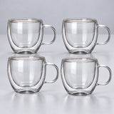 Four empty small 150 ml clear double-wall glass mugs with handles.