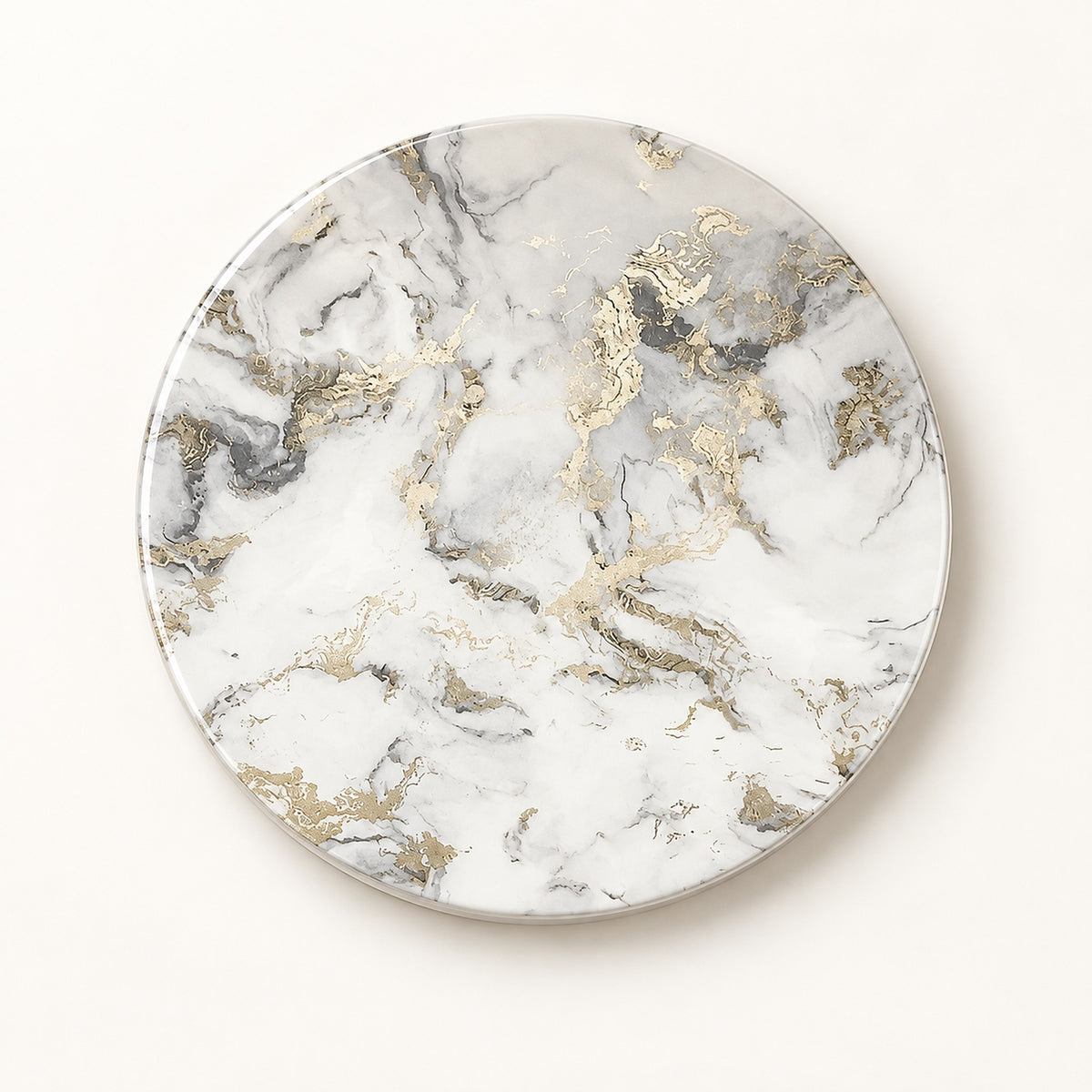 A round coaster or tray with a white marble pattern and metallic gold accents, photographed from directly above on a clean white background.