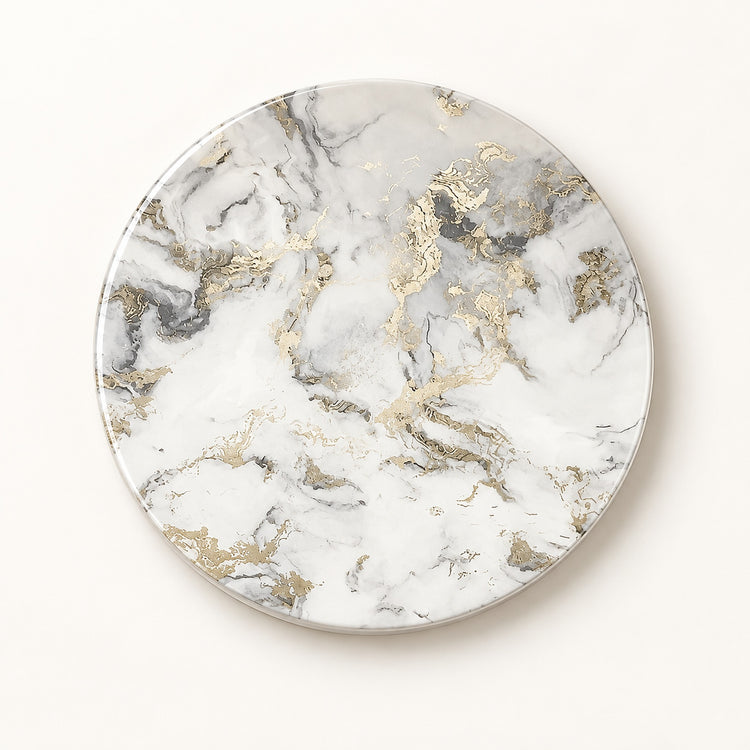 A round coaster or tray with a white marble pattern and metallic gold accents, photographed from directly above on a clean white background.