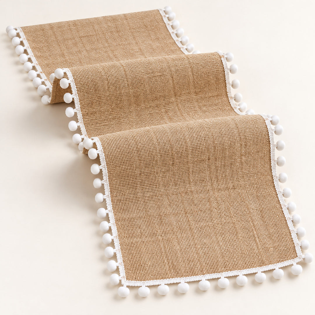 One tan runner with white pom pom trim, selected length.
