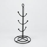 One empty black six-hook mug tree with circular base.