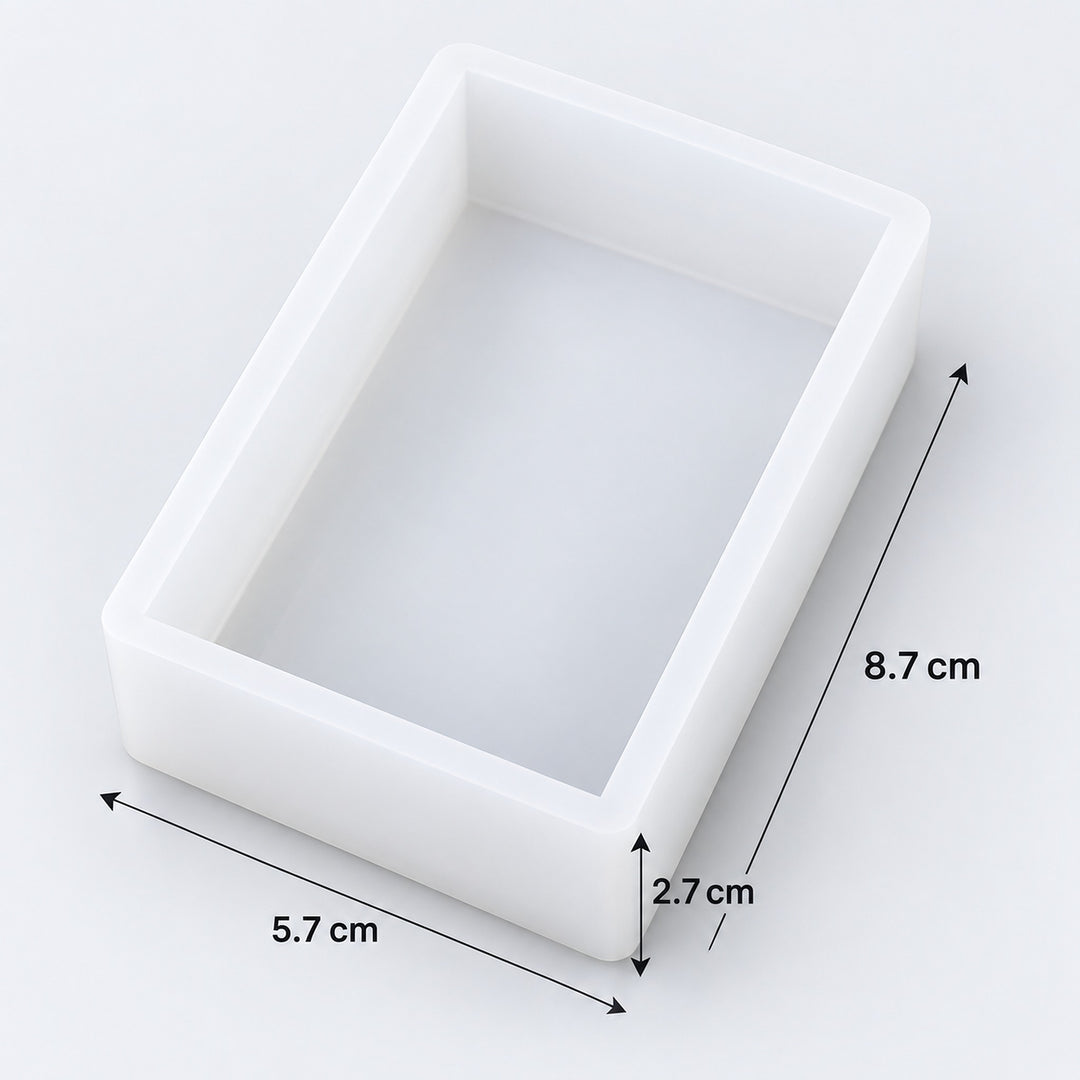 A white rectangular tray or mold shown on a light gray background with dimension arrows and labels indicating 8.7 cm, 5.