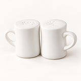 A pair of white ceramic mugs with matching perforated lids, shown side by side on a clean white background.