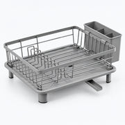Gray plastic and metal dish rack with a draining tray, wire drying rack, and integrated cup holder, shown on a clean white background.