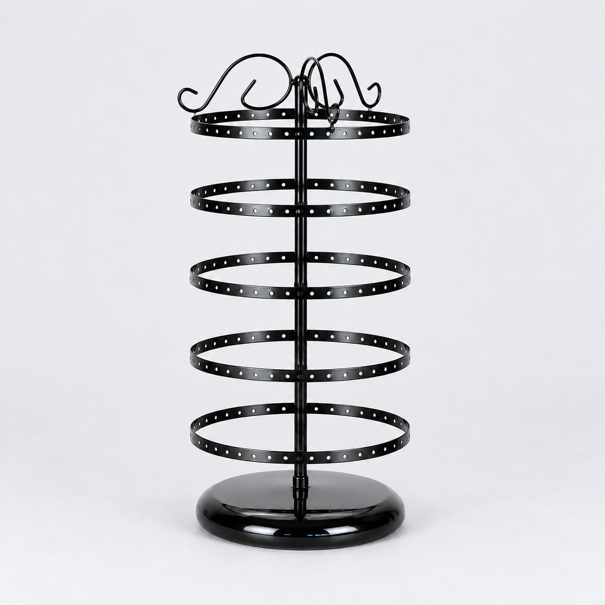 Empty black five-tier jewelry stand with domed circular black pedestal.