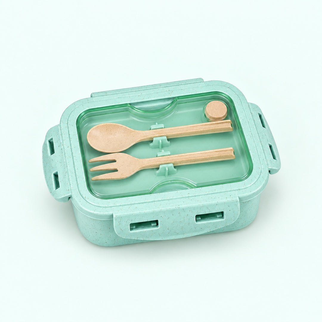 One assembled mint green lunch box with fork and spoon stored beneath clear lid.