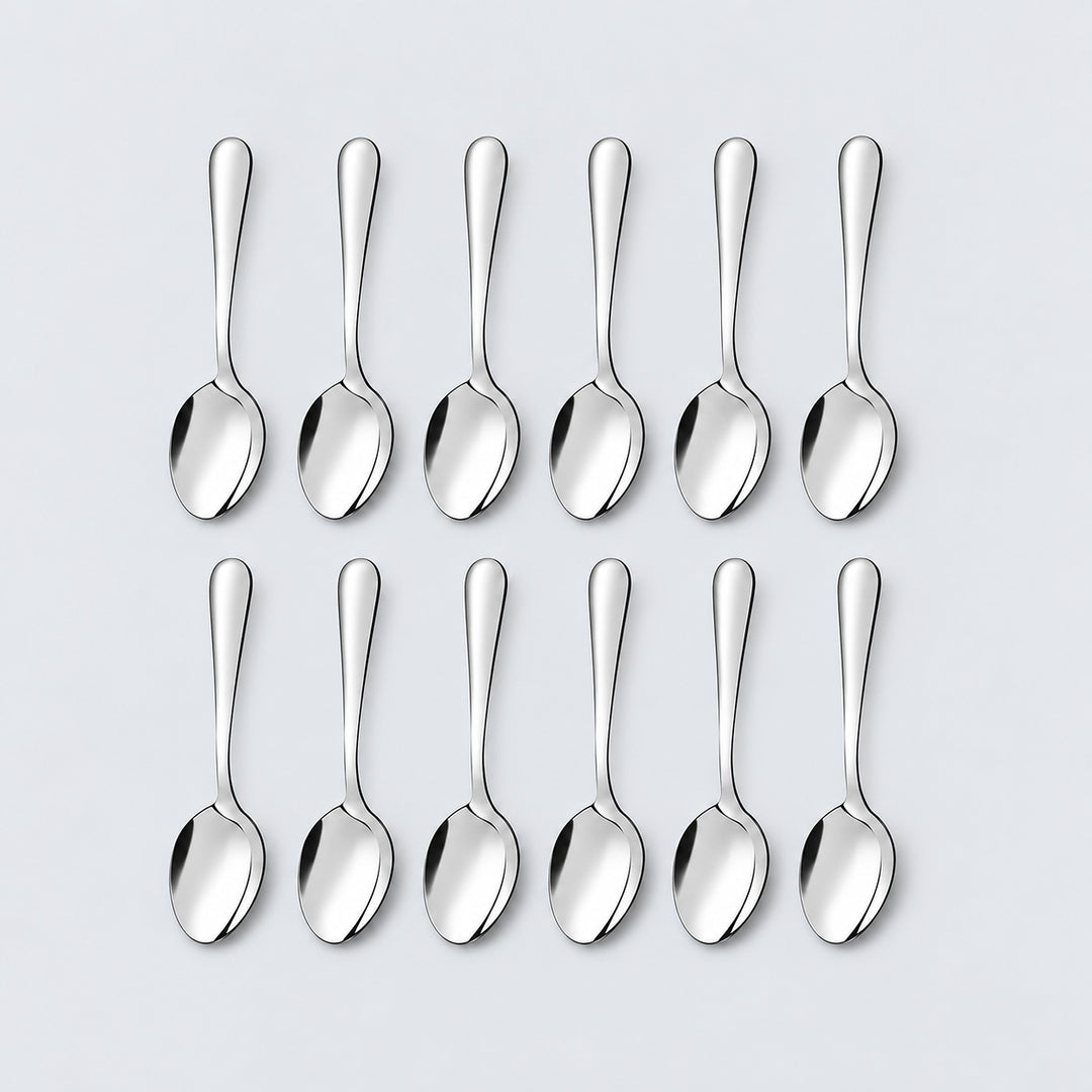Twelve silver teaspoons arranged in two rows of six on a pale gray background.