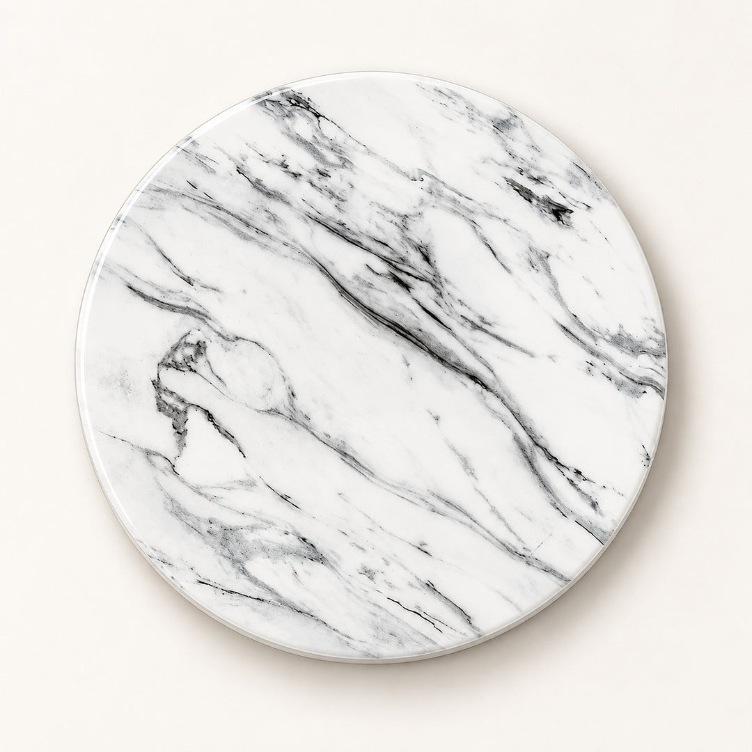 A round coaster with a white marble pattern featuring elegant gray and black veining, shown on a light beige background.