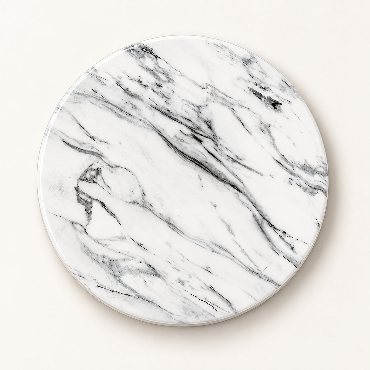 A round coaster with a white marble pattern featuring elegant gray and black veining, shown on a light beige background.