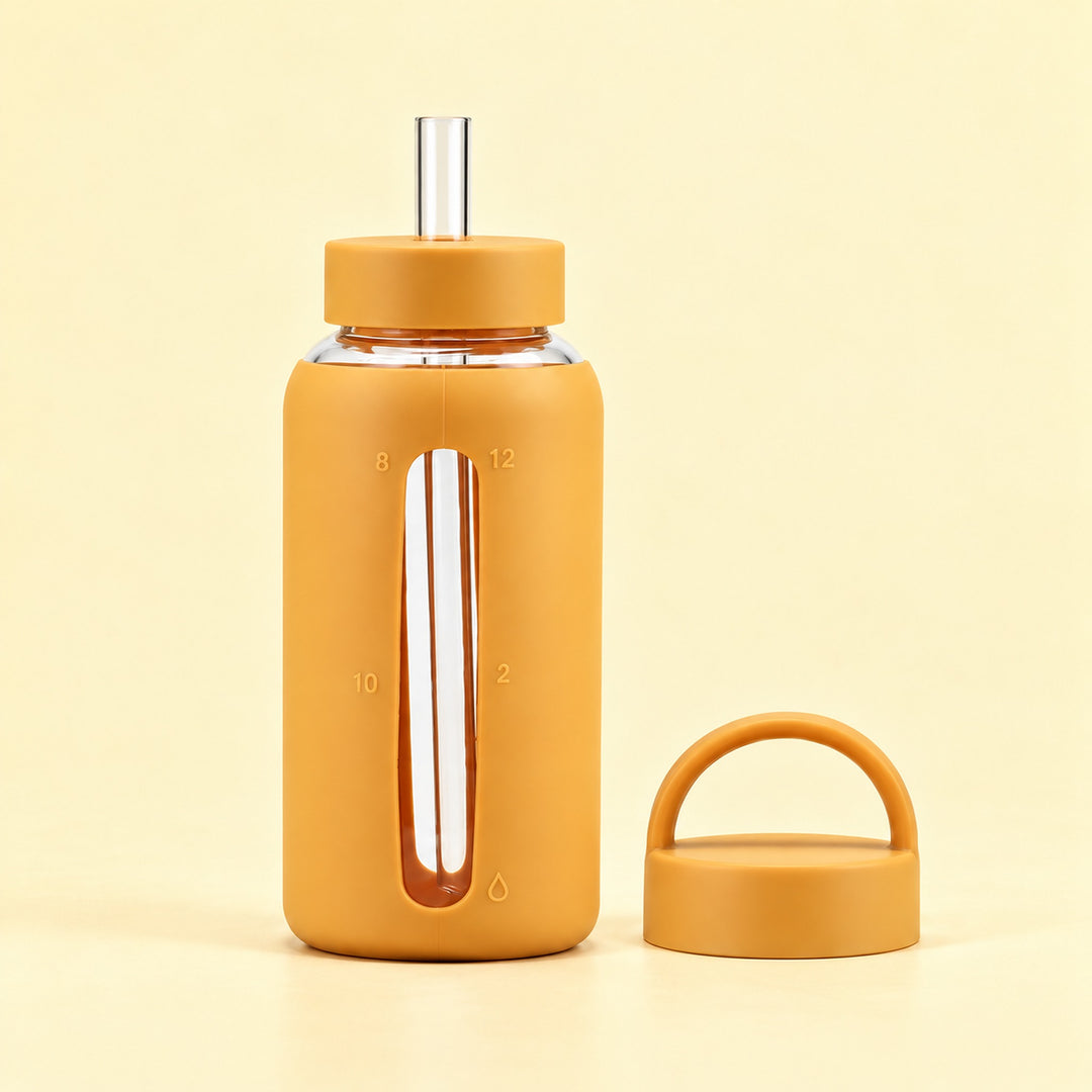 Yellow 800 ml glass bottle with silicone sleeve, wide straw and spare loop lid.