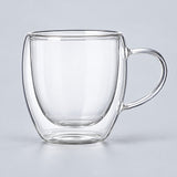 One empty rounded 250 ml clear double-wall glass mug with handle.