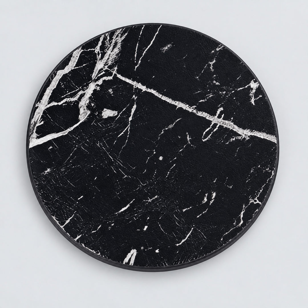 One black artificial-leather coaster, 10 cm.