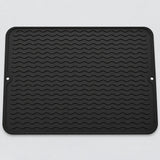 Black wavy-ridge silicone mat with two hanging holes.