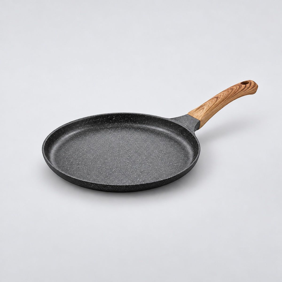 Black 24 cm Maifan-coated pan with wood-grain bakelite handle, empty.