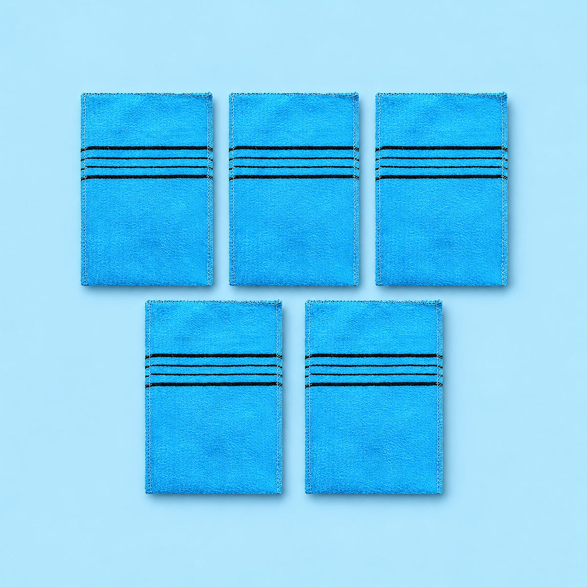 Blue variant: five blue rectangular exfoliating mitts on a lighter blue studio background.
