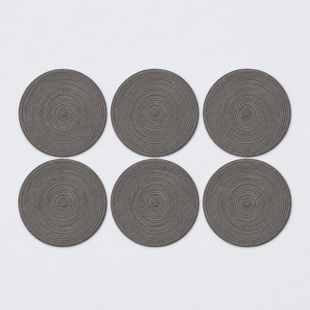 Six dark gray braided round mats.