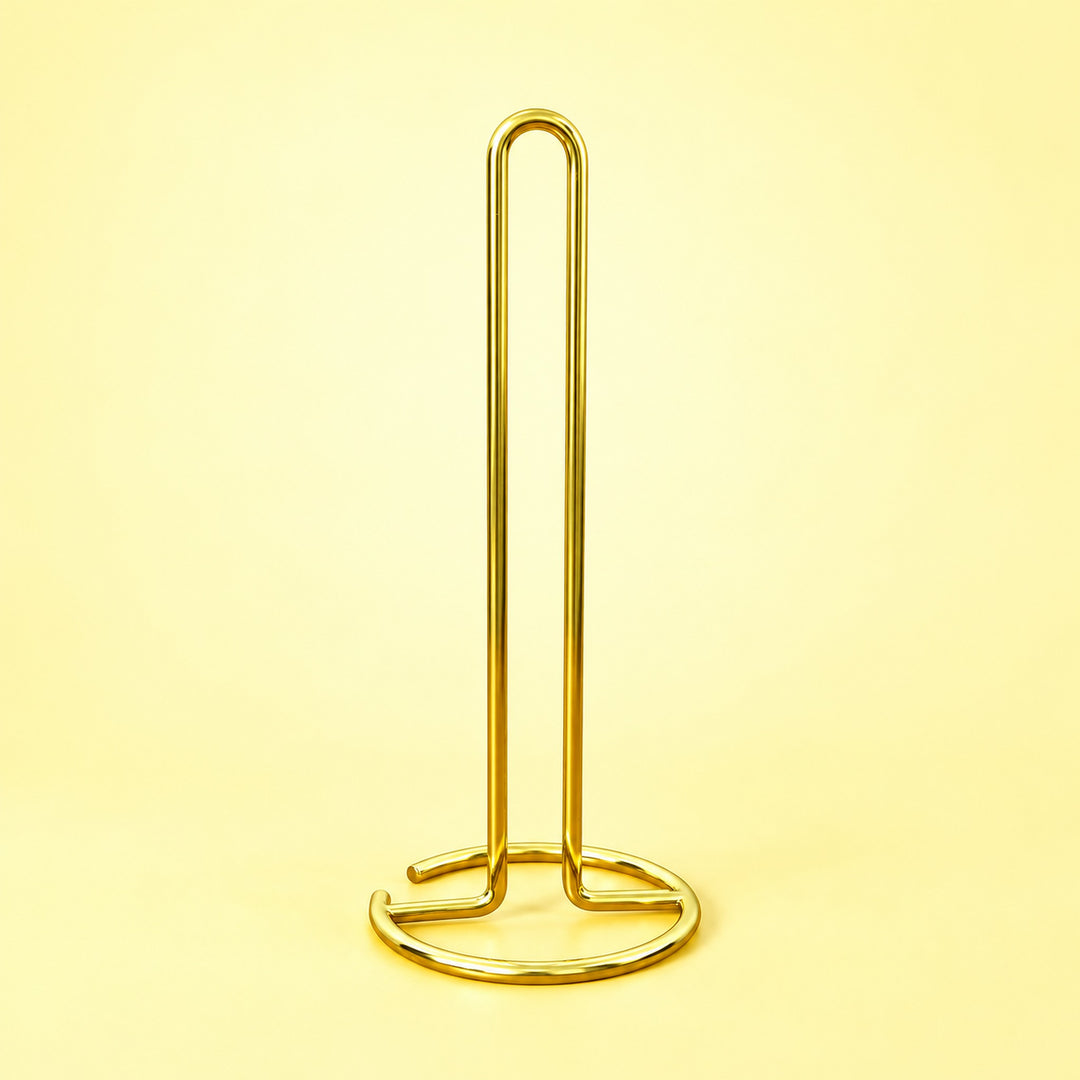 Empty gold upright paper towel stand with open wire base.