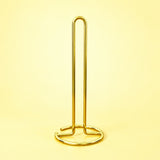 Empty gold upright paper towel stand with open wire base.