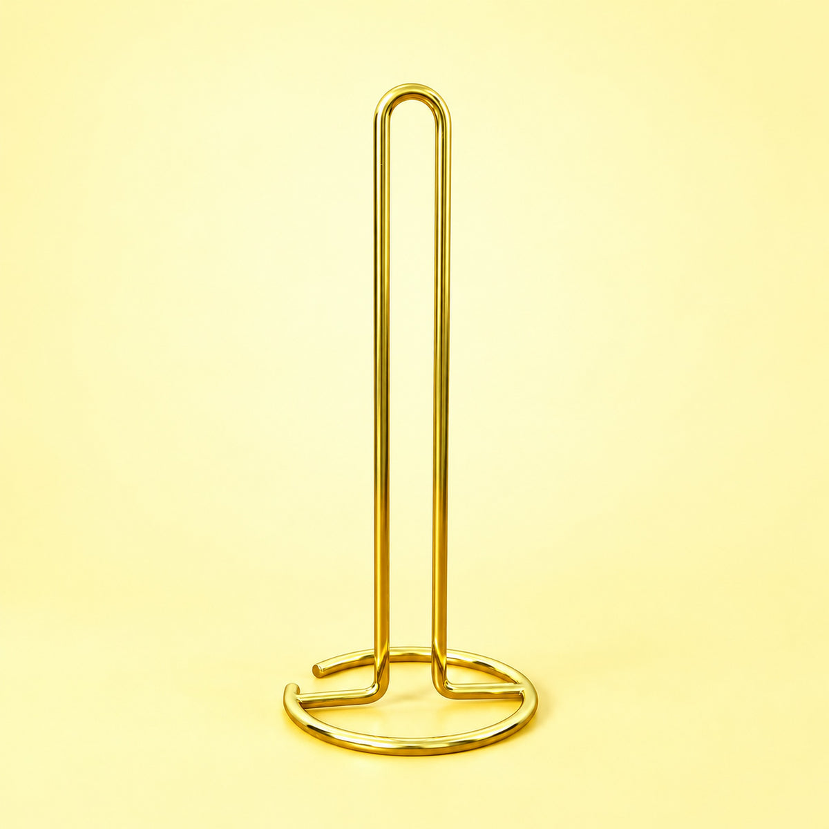 Empty gold upright paper towel stand with open wire base.