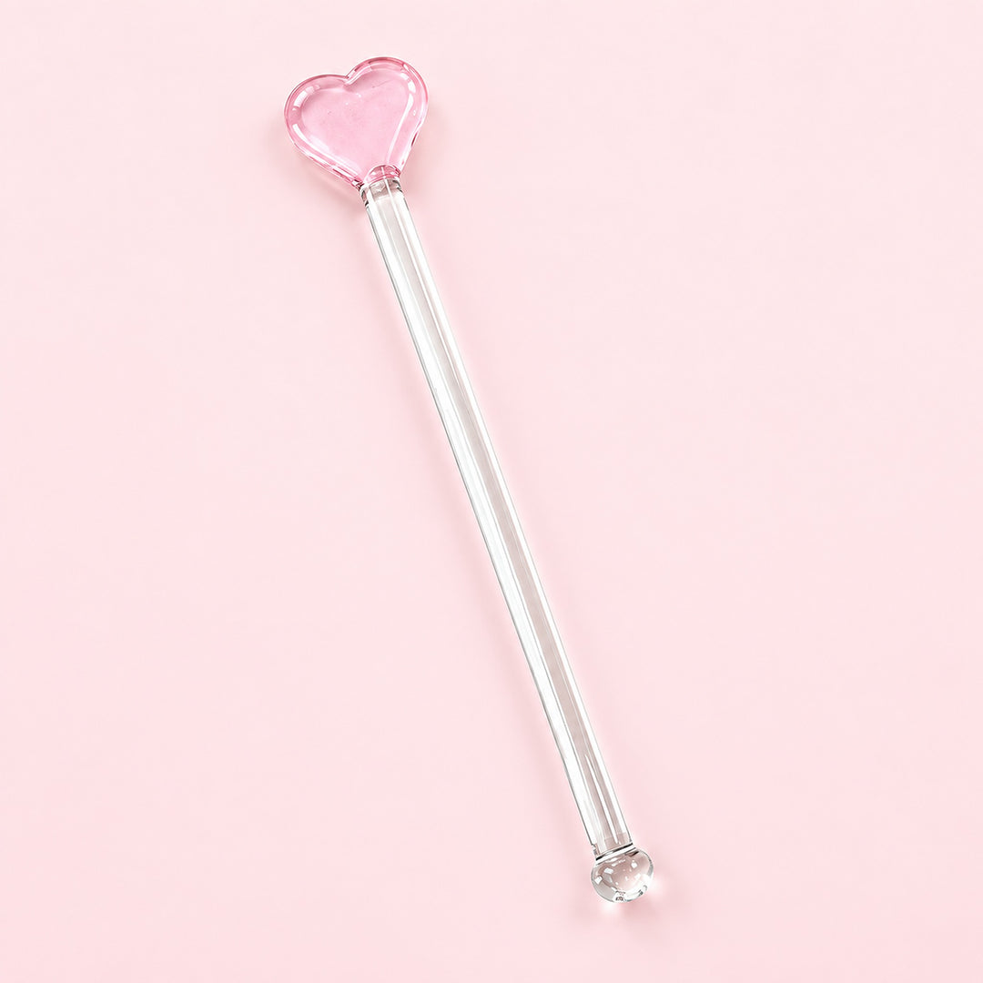 One pink Heart glass stirrer, approximately 12.5 cm long, on pale pink studio background.