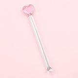 One pink Heart glass stirrer, approximately 12.5 cm long, on pale pink studio background.