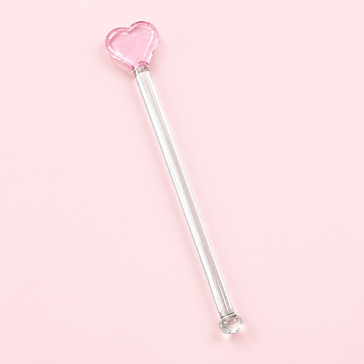One pink Heart glass stirrer, approximately 12.5 cm long, on pale pink studio background.
