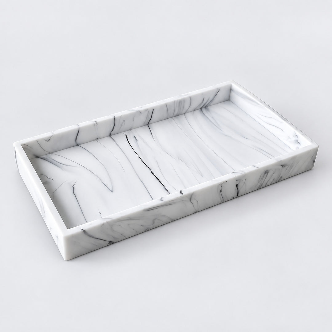 A rectangular marble tray with a white and gray swirled pattern, shown from an elevated angle on a light gray background.