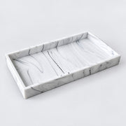 A rectangular marble tray with a white and gray swirled pattern, shown from an elevated angle on a light gray background.