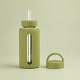 Matcha Green 800 ml glass bottle with silicone sleeve, wide straw and spare loop lid.