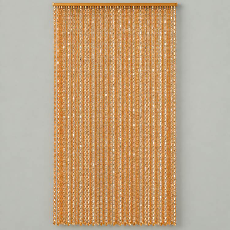 A vertical curtain panel made of hanging narrow strands of metallic gold sequins, suspended from a matching gold rod against a solid light gray background.