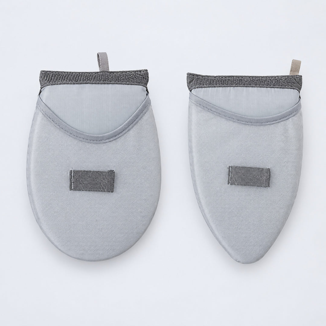One rounded and one tapered garment-steaming pad.
