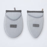 One rounded and one tapered garment-steaming pad.