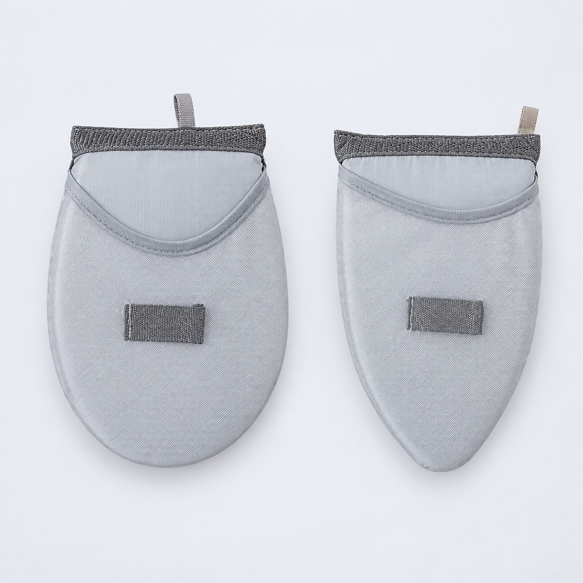 One rounded and one tapered garment-steaming pad.