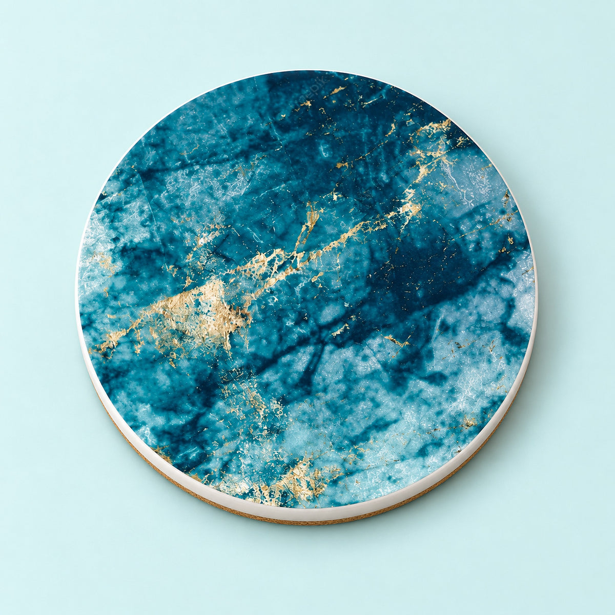 One teal and gold marble printed ceramic coaster on a light studio background.
