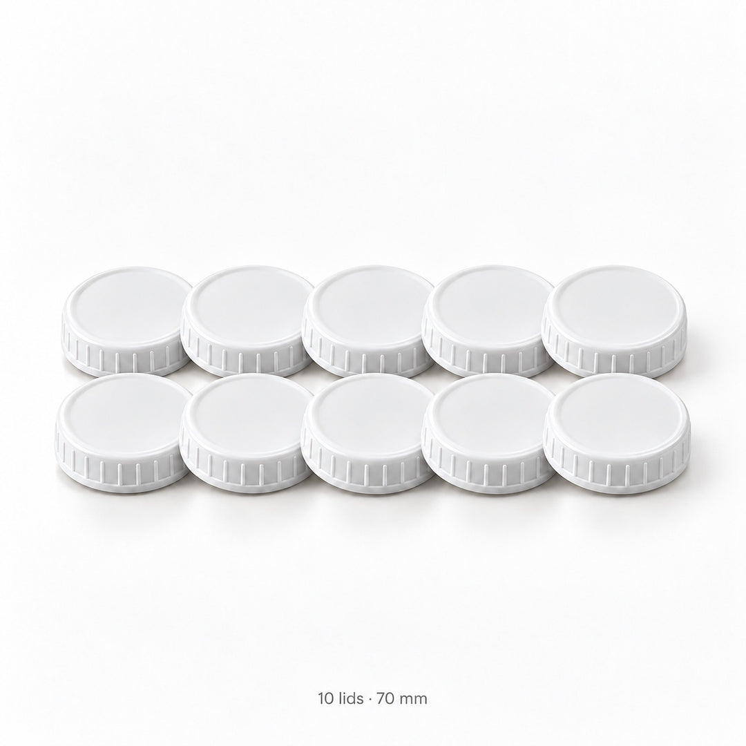 Set of ten white 70 mm ribbed plastic mason jar lids.