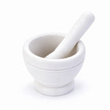 White variant: one white mortar with one matching pestle on a bright studio background.