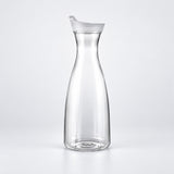 Empty 600 ml clear plastic carafe with white lid.