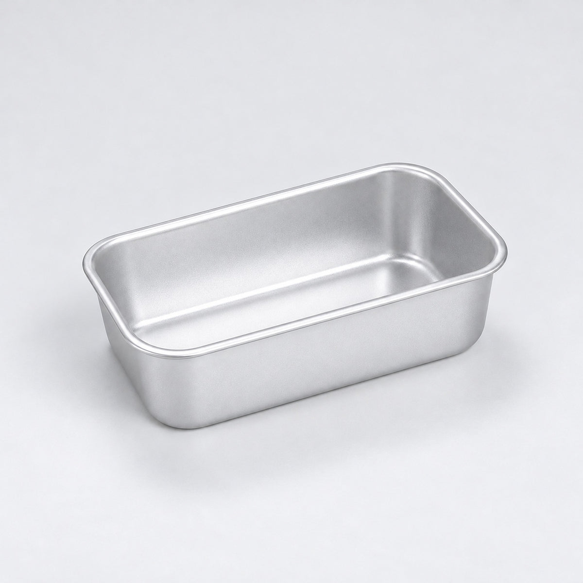 Empty silver aluminum loaf pan, 12 x 7 x 3.8 cm.