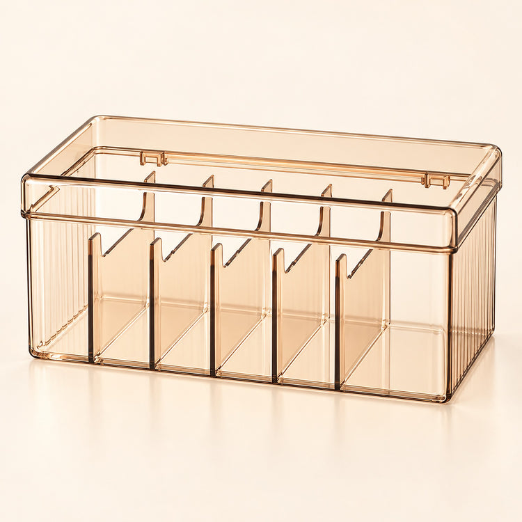 A translucent smoky amber plastic organizer box with multiple vertical compartments and a hinged lid, shown on a clean off-white background.